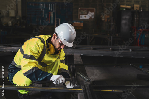 Mechanic/Worker use the tool measuring the part in metal factory