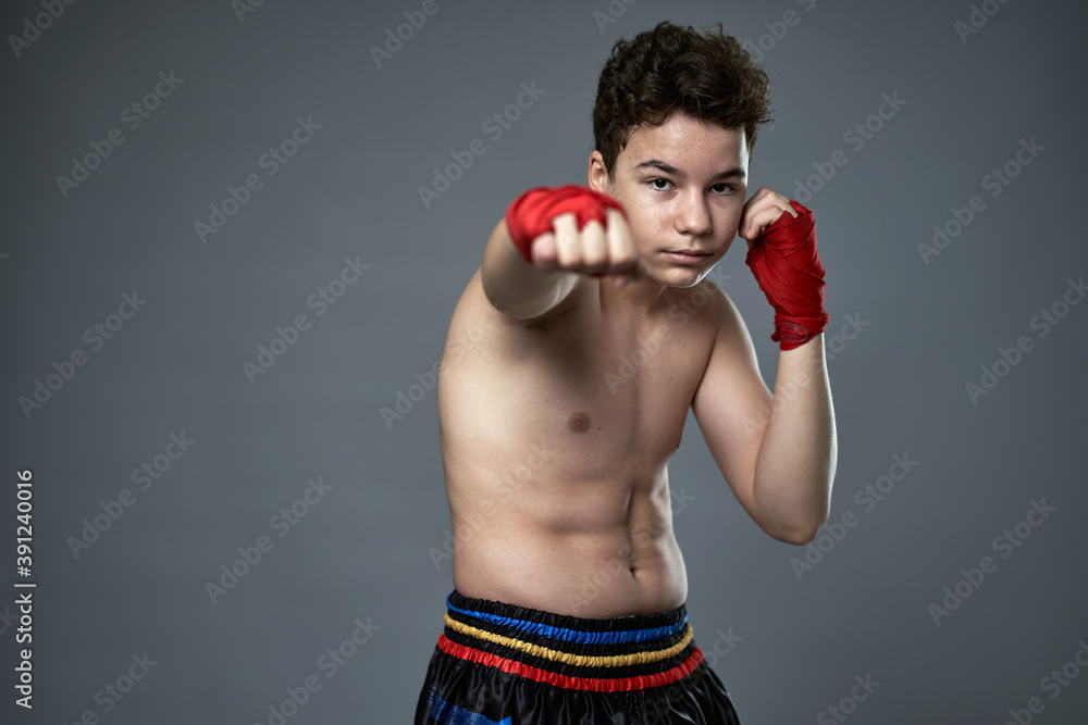 Teenage kickboxer training