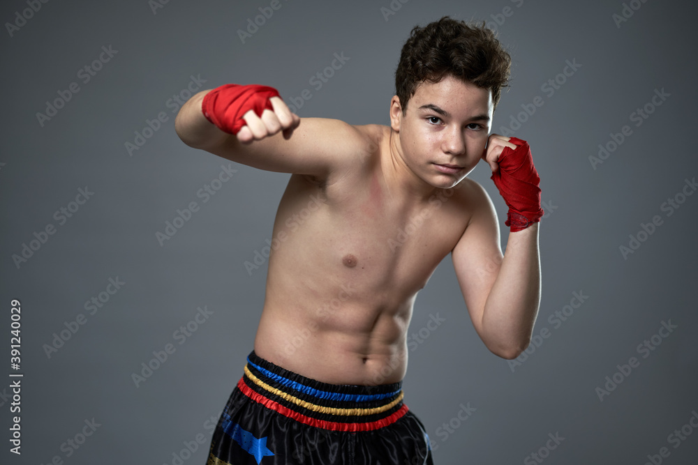 Teenage kickboxer training