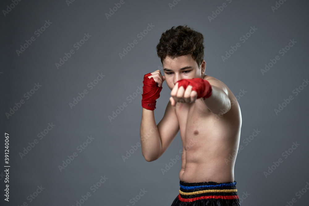 Teenage kickboxer training