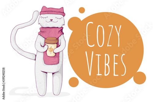 Cute white cat wearing cozy scarf and hat and hold mug with pumpkin latte. Cozy vibes text. Cozy winter or fall concept. Best for print, textile or web.