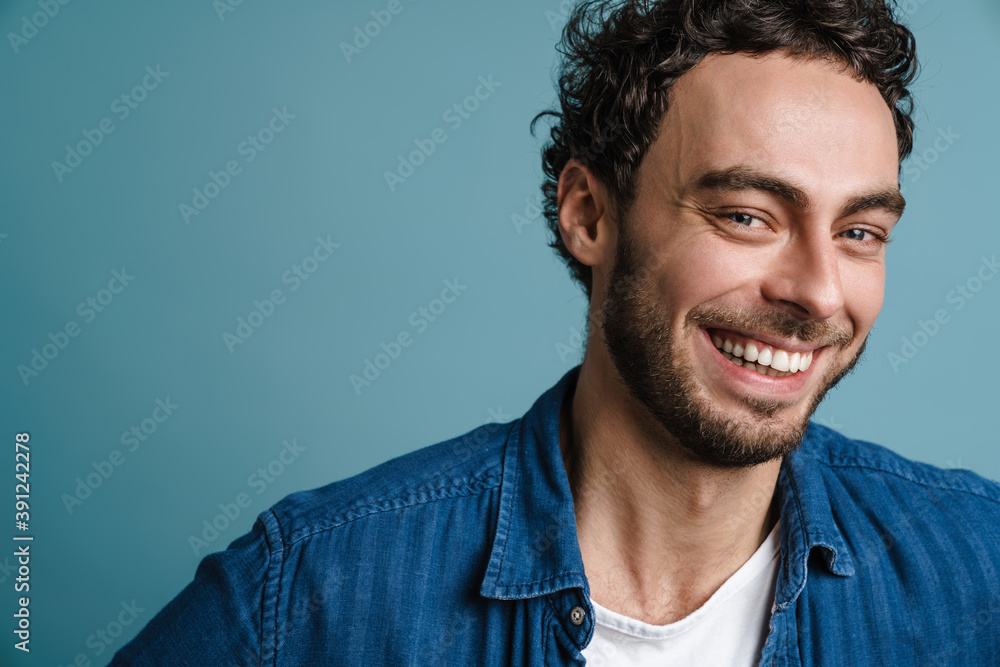 Happy handsome guy laughing and looking at camera Happy handsome guy laughing and looking at camera