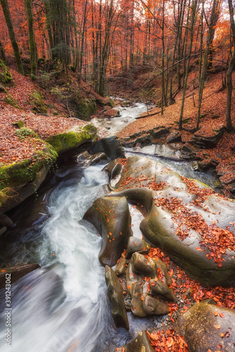 Amazing nature landscape with mountain creek and bizarre stones in the colorf...