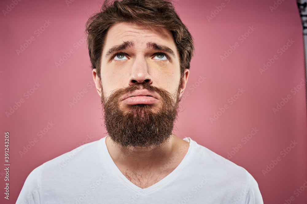 bearded man in white t-shirt emotions displeased facial expression studio pink background bearded man in white t-shirt emotions displeased facial expression studio pink background