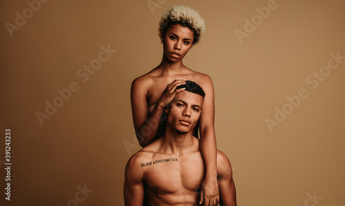 African american couple together on brown background