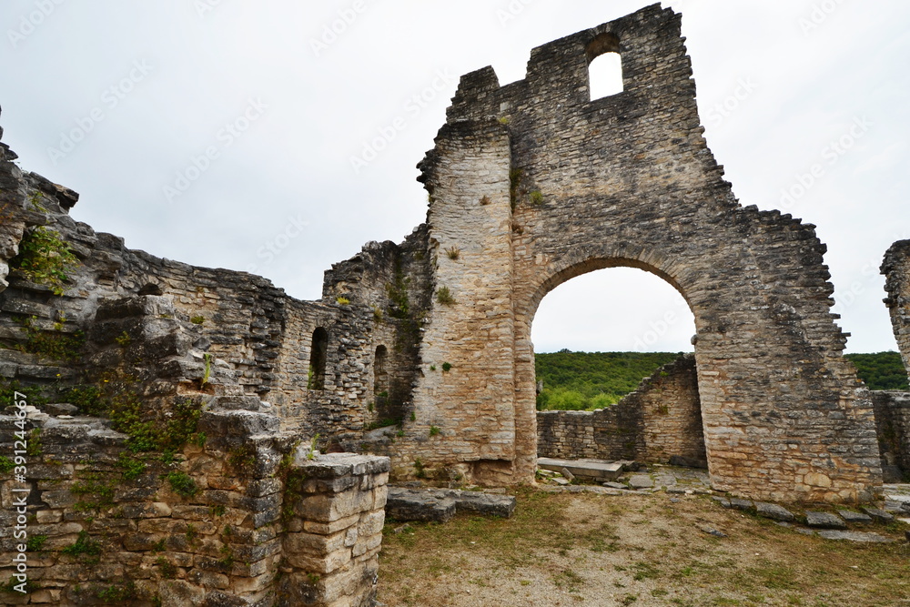 Ruins of stone buildings of a medieval city in the Mediterranean