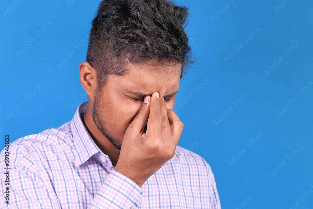 Close up of upset man suffering from strong eye pain Close up of upset man suffering from strong eye pain