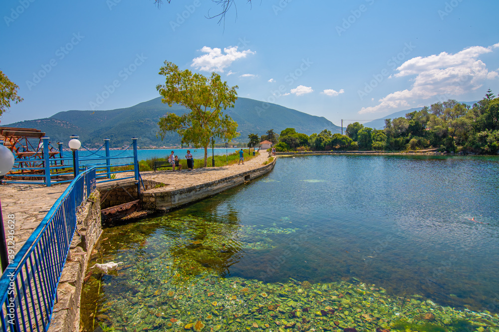 Karavomilos lake with colorful calm waters in Kefalonia Greece. 