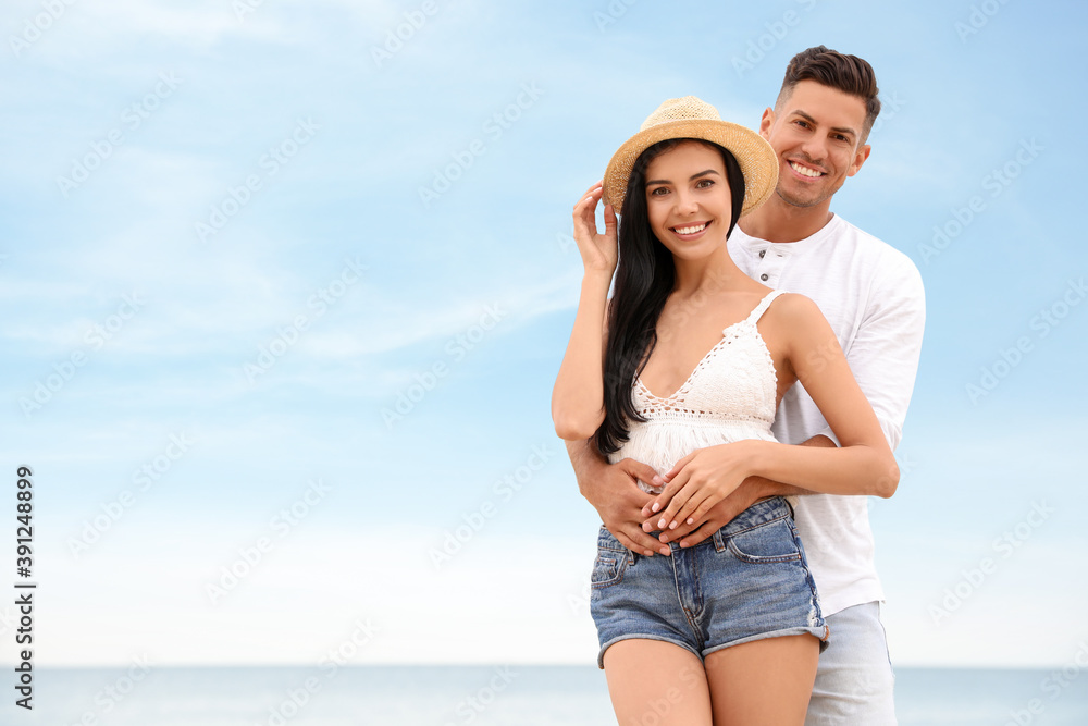 Lovely couple spending time together on beach. Space for text Lovely couple spending time together on beach. Space for text