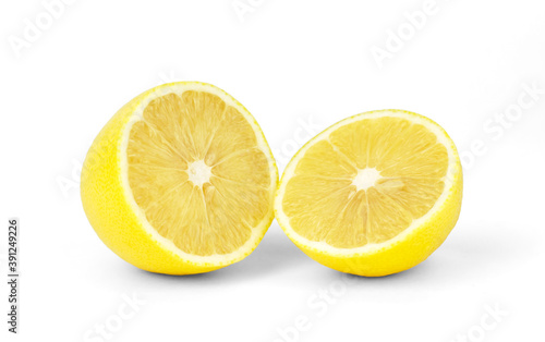 Lemon cut in half on white isolated background.
