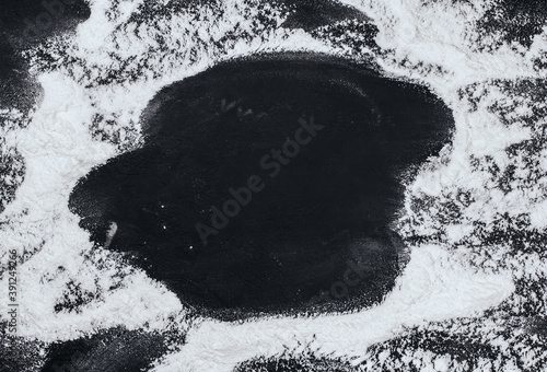 Flour on a black background copy space