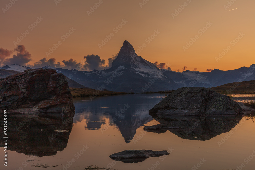 Matterhorn sunset with reflection in lake Stellisee, near Fluhalp and Zermatt, Wallis, Switzerland