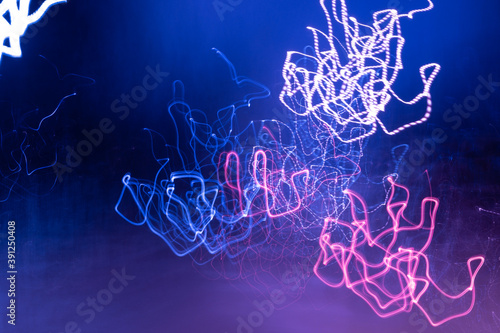 Abstract colorful light trails in the dark, motion blur effect