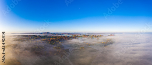 Drone image of morning ground fog over fields in the German province of North Hesse near the village of Rhoden