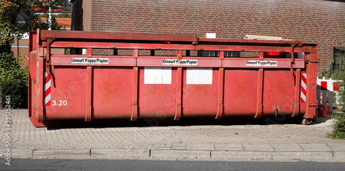 Roter  Container für Altpapier auf der Straße stehend  ,  Deutschland, Europa photo