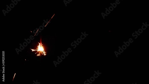 Slow video clip of a yellow scab splashing from fireworks and Black background.