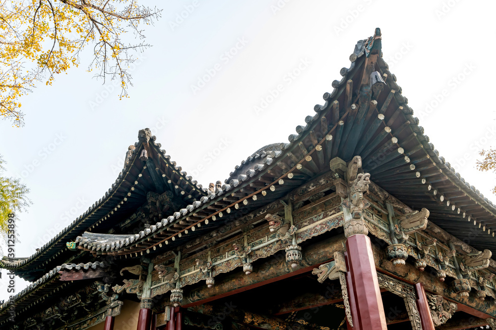 In autumn, ancient building lofts and ginkgo trees are in Jinci Park, Taiyuan, Shanxi, China