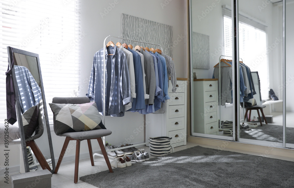 Dressing room interior with clothing rack and mirror - obrazy, fototapety, plakaty 