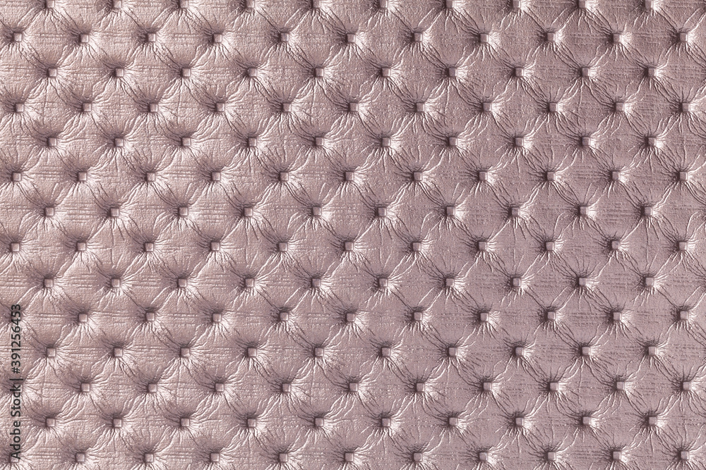 Texture of light brown leather background with capitone pattern, macro. Texture of light brown leather background with capitone pattern, macro.