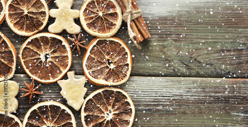 Christmas cookies with cinnamon on wooden background. © Alona