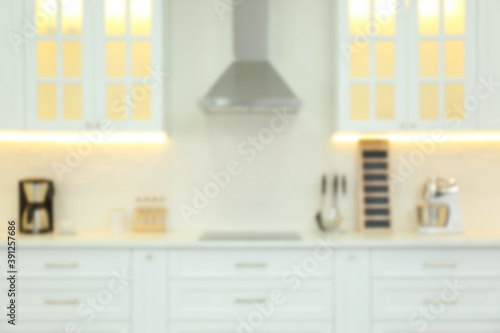 Blurred view of modern kitchen interior with stylish furniture