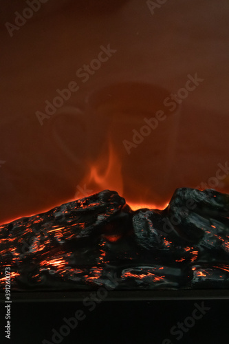 Small decorative fireplace with various sweets and reflections