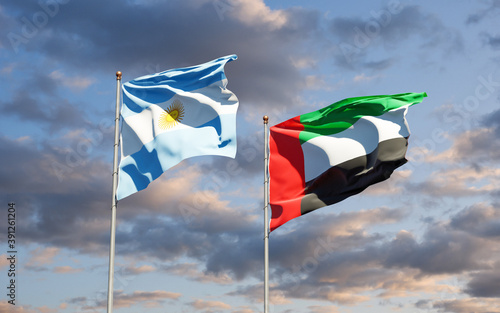 Beautiful national state flags of UAE United Arab Emirates and Argentina together at the sky background. 3D artwork concept.