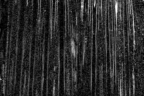 texture, crumpled plastic film on black with small splashes of water © Анастасия Гайкова