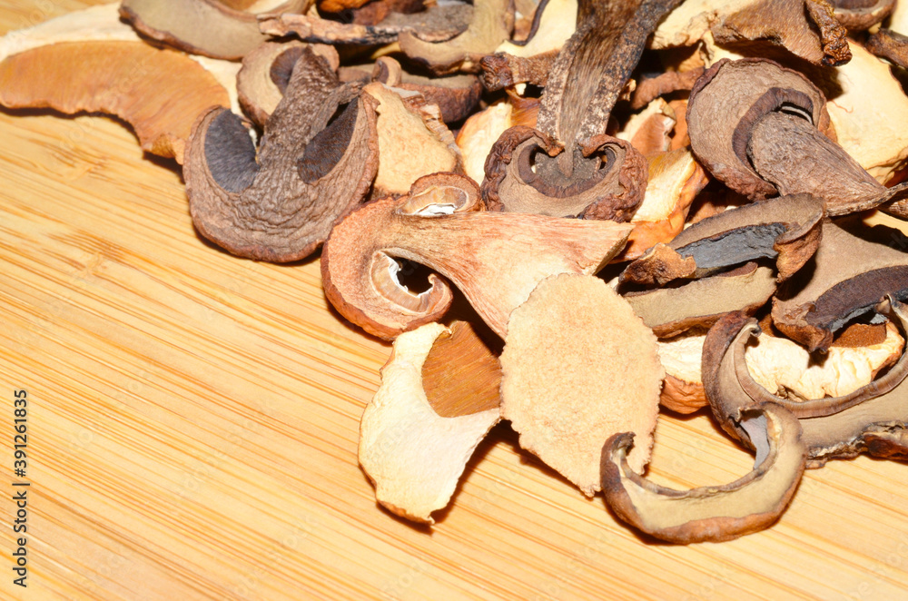 Dried mushrooms on the wooden table Dried mushrooms on the wooden table