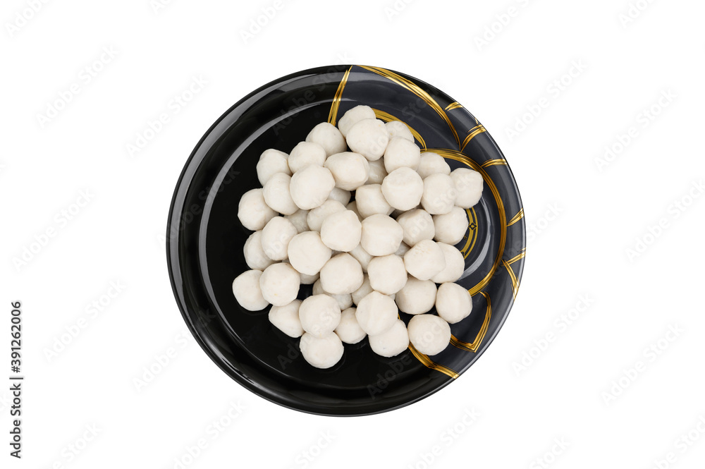 Top view of Meat or fish ball placed in a black plate isolated on white background Top view of Meat or fish ball placed in a black plate isolated on white background