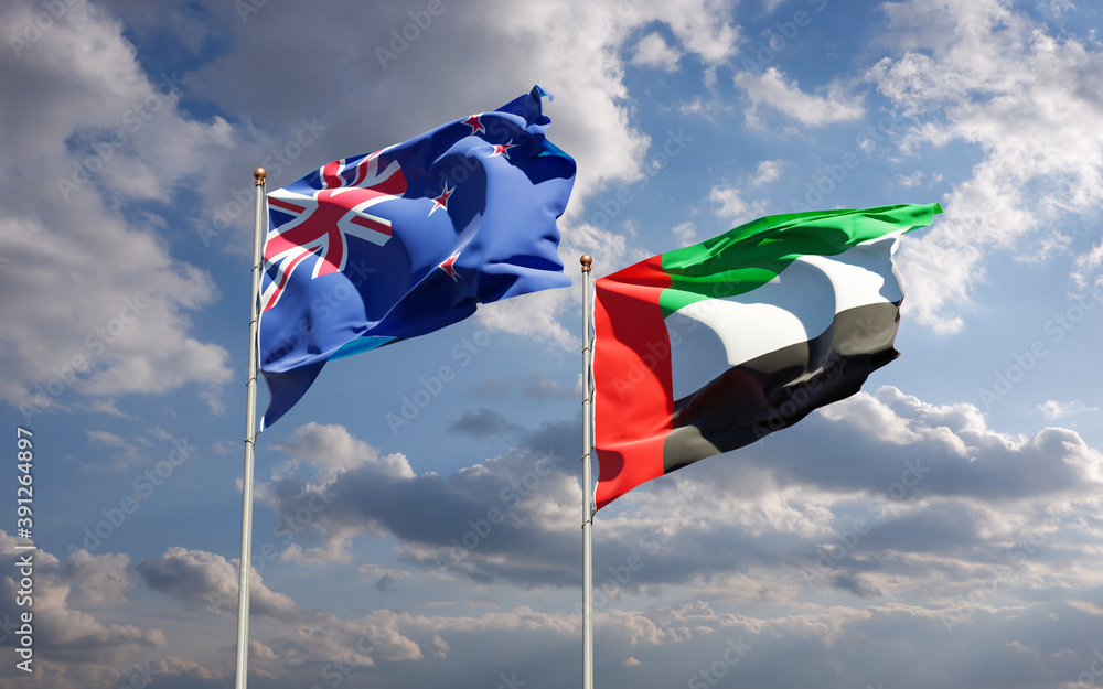 Beautiful national state flags of New Zealand and UAE United Arab Emirates together at the sky background. 3D artwork concept. Beautiful national state flags of New Zealand and UAE United Arab Emirates together at the sky background. 3D artwork concept.