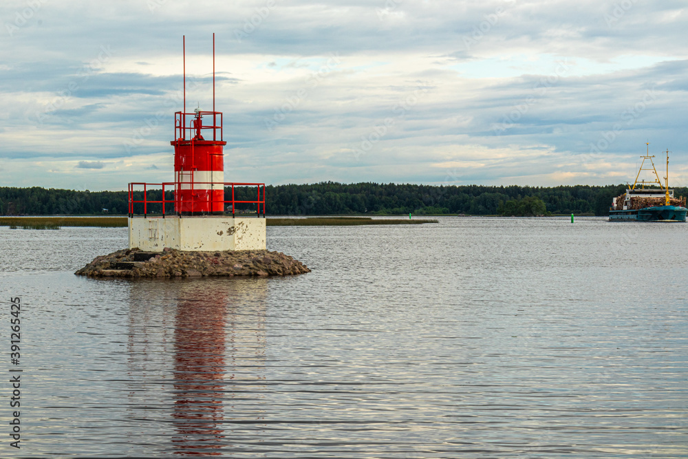 water sign on a natural reservoir, sea to indicate danger near the shore against a beautiful sky