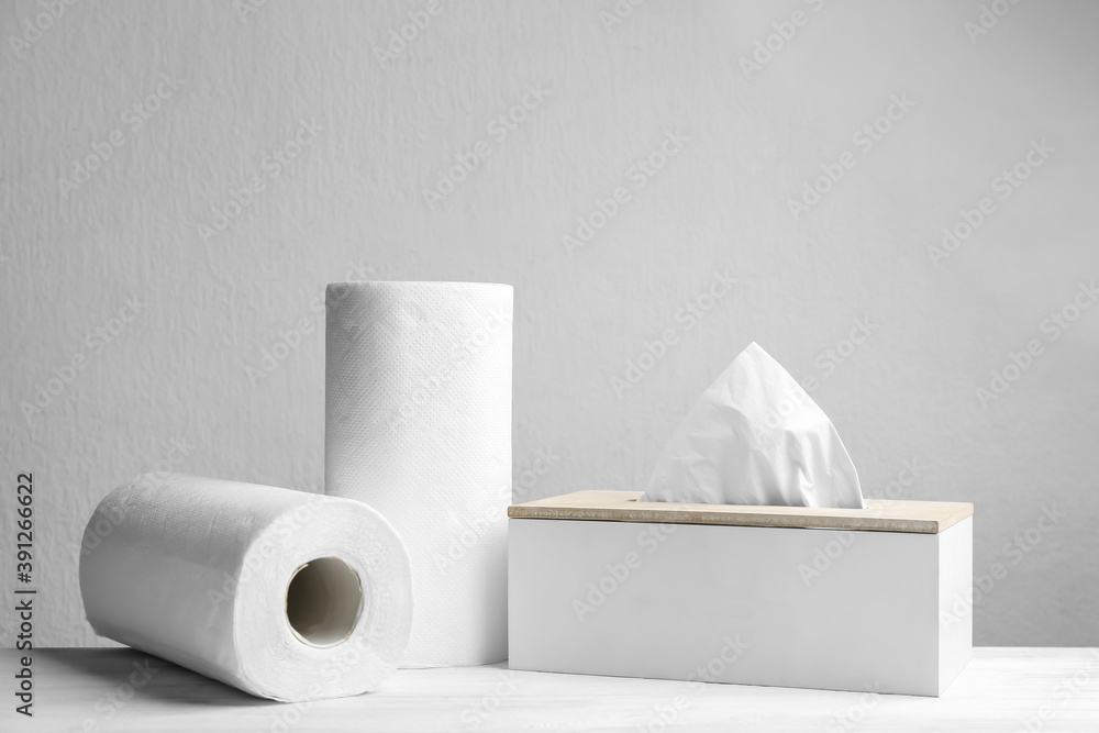 Fototapeta Rolls of paper towels and tissues on white table