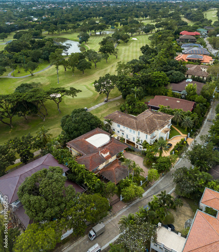 An exclusive gated community in southern Metro Manila with an adjacent golf course. Aerial of Ayala Alabang Village photo