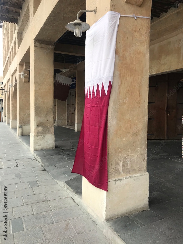 Qatari flag hanging outside a shop in Souk Waqif, Doha, Qatar