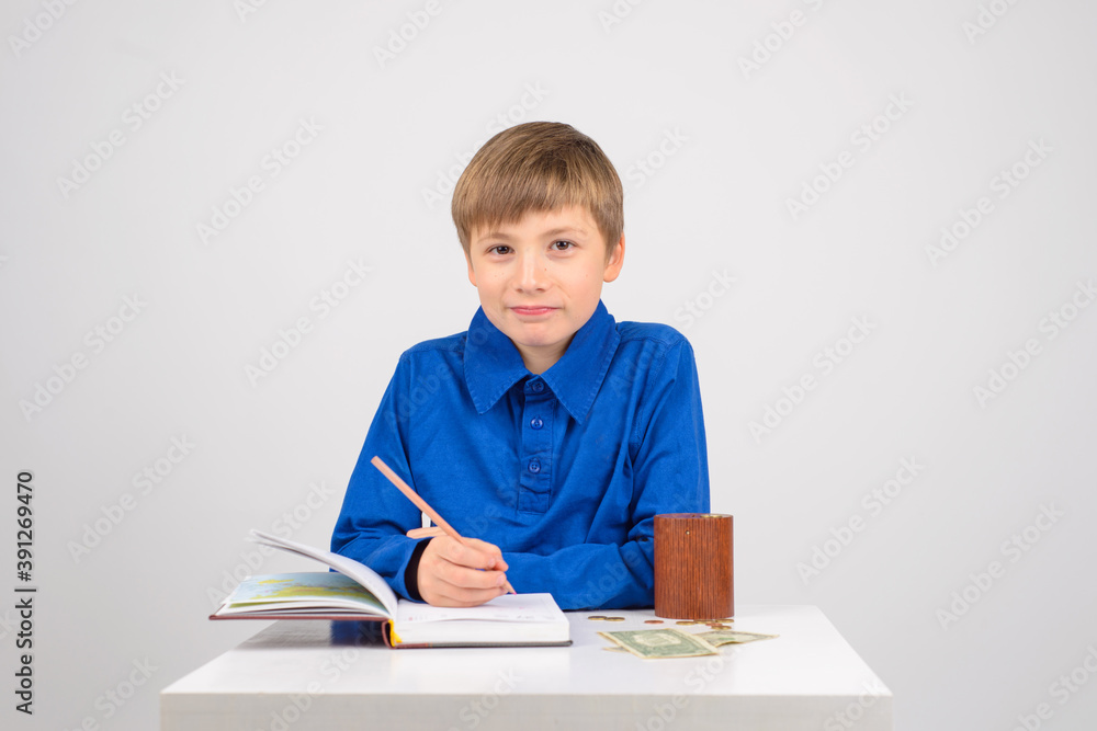 young businessman Young smart boy writes in a notebook with fina young businessman Young smart boy writes in a notebook with fina