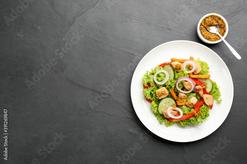Delicious fresh chicken salad served on black table, flat lay. Space for text