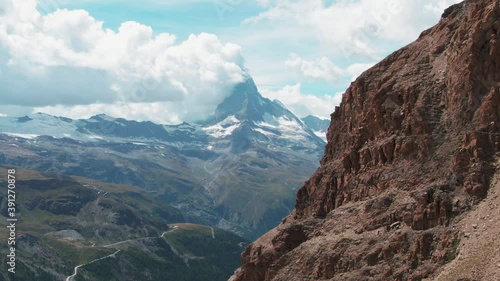 Dolly Shot towards the famous Matterhorn Mountain in Zermatt, Switzerland on a cloudy day photo