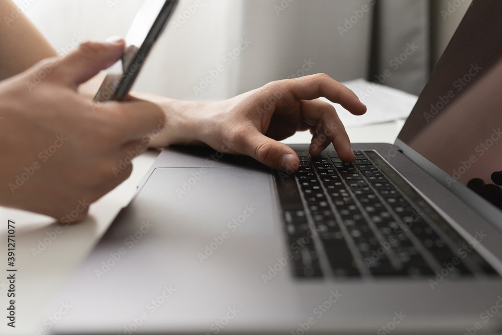 A man works at home using a laptop. Remote work concept during a pandemic A man works at home using a laptop. Remote work concept during a pandemic
