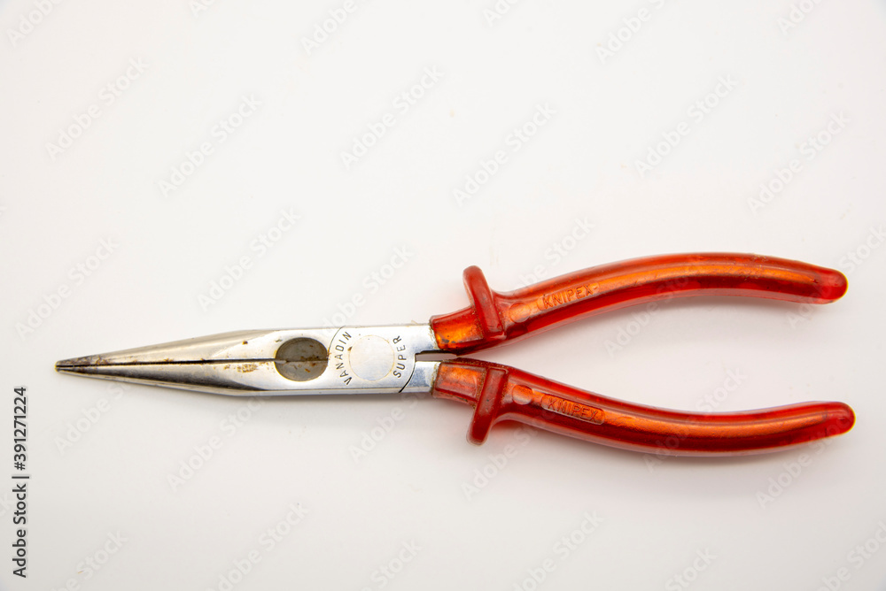 Pliers with red handles on a white background. Pliers with red handles on a white background.