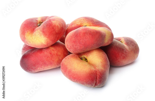 Fresh ripe donut peaches on white background