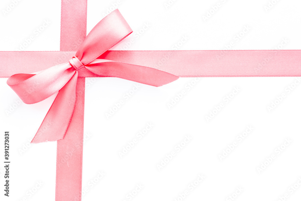 Pink ribbon with bow isolated on white for gift box. Top view, copy space Pink ribbon with bow isolated on white for gift box. Top view, copy space