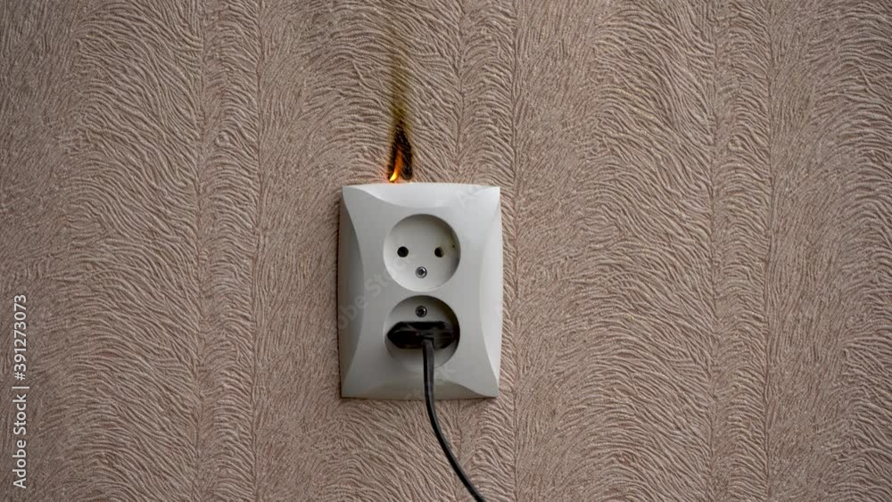 Stockvideon Closeup. Smoke comes from a faulty outlet in the apartment