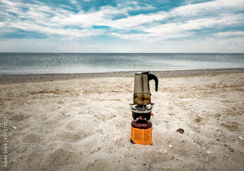 geyser coffee maker brews coffee on a tourist gas burner
