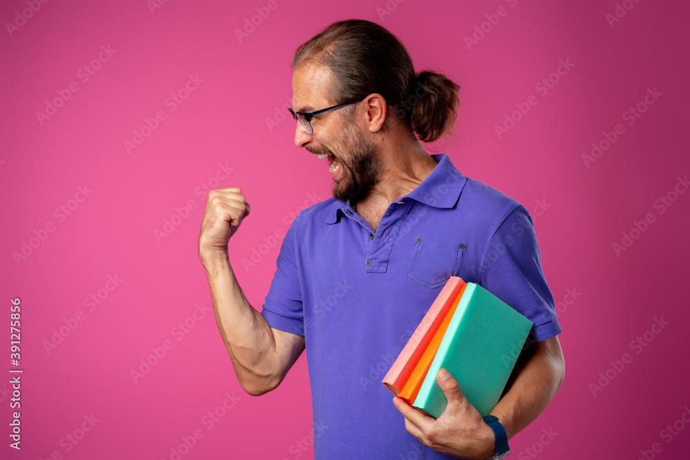 Overjoyed funny bearded man in glasses celebrating success Overjoyed funny bearded man in glasses celebrating success