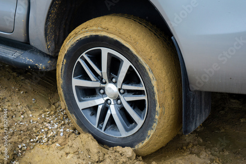 Car wheels stuck in mud © top