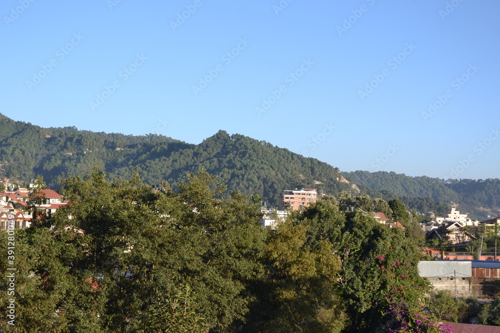 forest, hills, blue sky, green trees and beautiful landscape. Pictured in Kathmandu valley, Nepal.