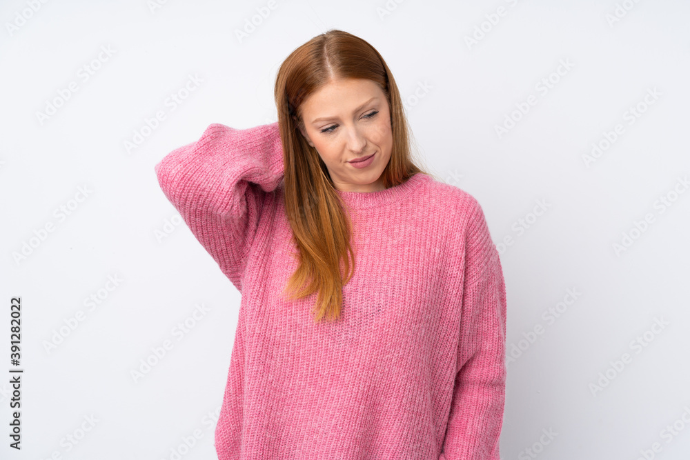 Young redhead woman with pink sweater over isolated white background with neckache Young redhead woman with pink sweater over isolated white background with neckache