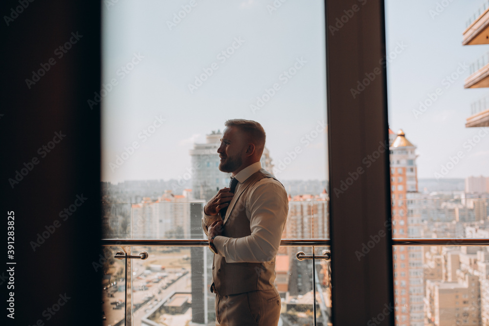 Portrait of the groom. The groom is preparing to meet the bride. Photo session of a young businessman. Portrait of the groom. The groom is preparing to meet the bride. Photo session of a young businessman.