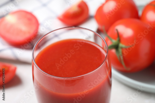 Delicious fresh tomato juice in glass, closeup